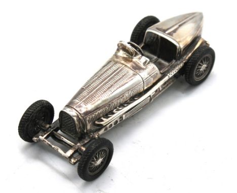 A Modern silver novelty model of a Bugatti racing car, with detailed realistic features and rubber tyres, marked 925 undernea