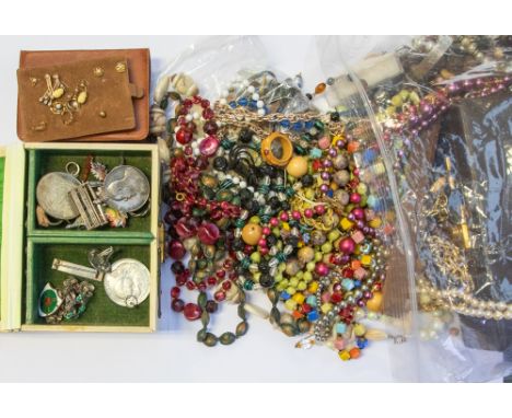 A collection of mixed costume jewellery to include; 1930s or later bead necklaces; faux pearl necklaces; three base metal fas