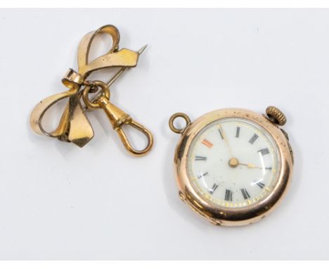 A ladies 9ct gold fob watch, case approx 25mm, total gross weight approx 13.3gms (a/f crown detached) along  with plated bow 