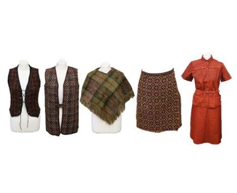 A collection of Welsh wool items to include: a tobacco-coloured waistcoat with a lace detail fastening of round metal hoops, 