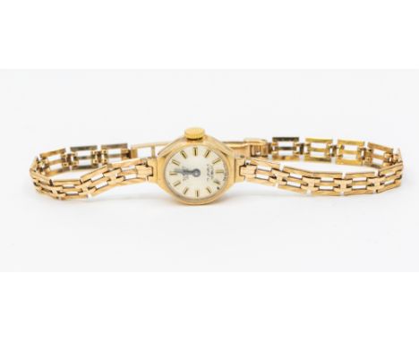 A ladies vintage 9ct gold Summit wristwatch, round silvered dial, baton makers, case approx 15mm, to a 9ct gold bracelet stra