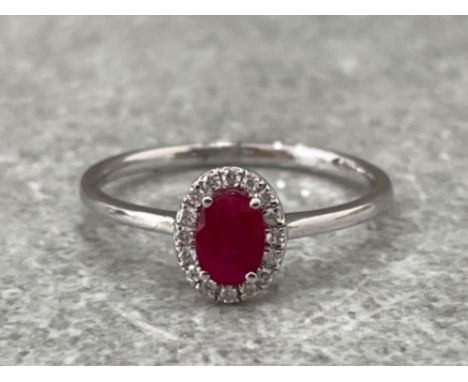 18CT WHITE GOLD RUBY AND DIAMOND RING .60CTS SIZE O 1.7G