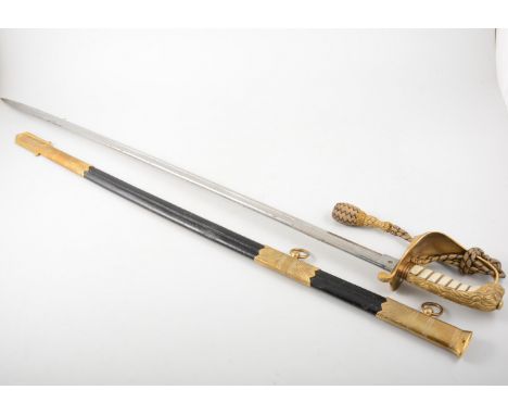 Victorian Royal Naval sword, brass hilt, engraved blade 90cm, with scabbard and knot.