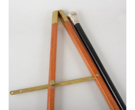 A British Army pace stick, polished mahogany with brass mounts and steel tips, 87cm long, a black swagger stick with silver p