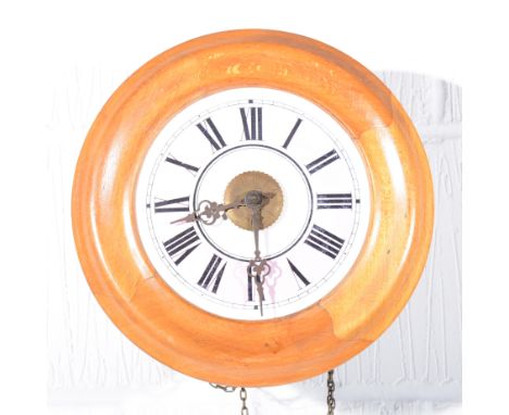 Beechwood cased postman's alarm clock, pink chapter ring, diameter 28cm.