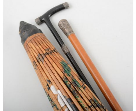 Victoria malacca walking cane, silver pommel, Sheffield 1886, repousee decoration, 89cm; Victorian and ebonised walking stick