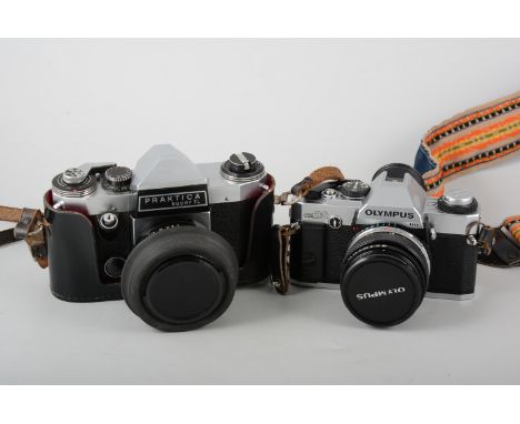 A collection of camera equipment to include - an Olympus OM 20 camera, a Praktica Super TL camera, various lenses and other a