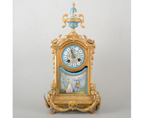 Gilt metal and Sevres style porcelain mantel clock in the Louis XVI taste, urn finial, case modelled with cherubs and swags, 