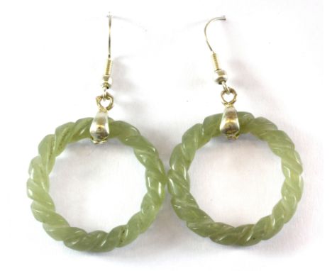 A pair of white metal (tested silver) carved jade earrings, L. 5cm.