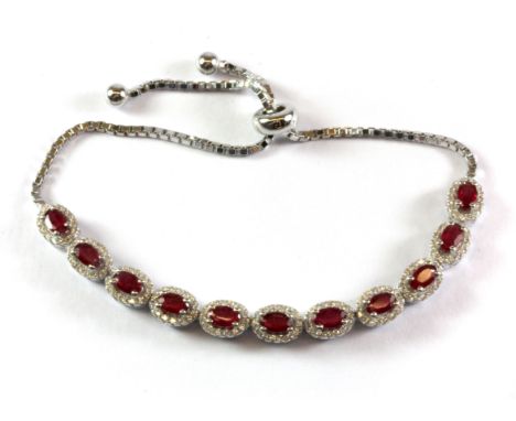 A 925 silver ruby set adjustable bracelet.