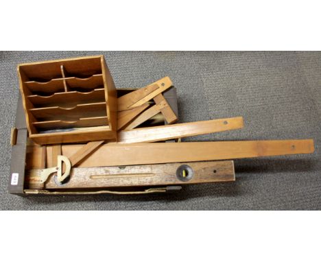 A collection of architect drawing tools and a letter rack.