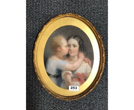 A gilt framed 19th Century oval pastel portrait of two children, 27 x 33cm.