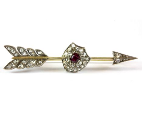 A Victorian style yellow and white metal (tested gold and silver ruby and diamond set brooch, L. 5.2cm.