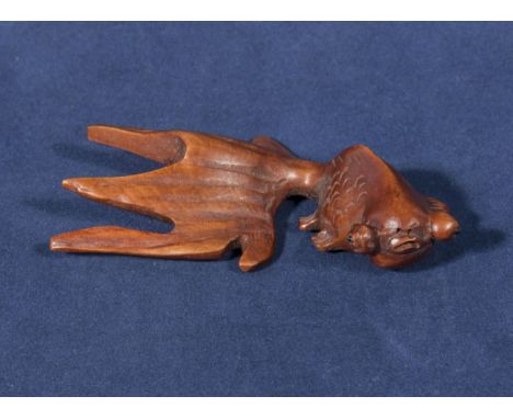 Hardwood netsuke of a goldfish