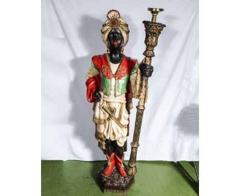 A life size blackamoor figure of a boy holding a staff wired for a lamp approx 40 years old made of modern materials. 1.4m ta