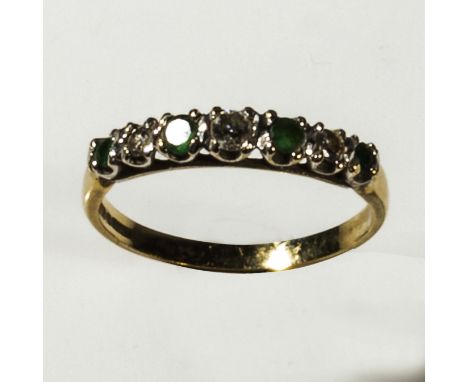 A 9ct gold seven stone emerald and diamond ring, size N