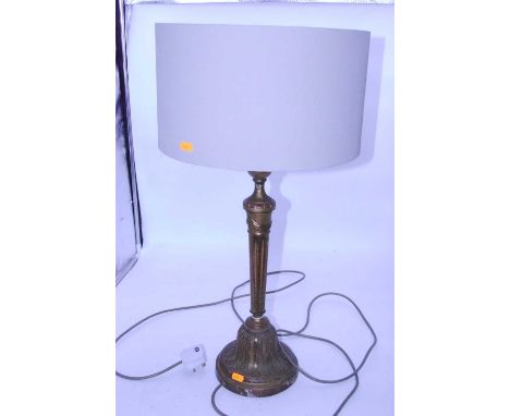 A gilt wood table lamp in the form of a classical candlestick having an urn shaped sconce to a fluted column and fluted bell 