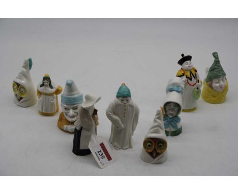 A collection of Royal Worcester figural candle-snuffers, to include Mr Caudle, Old Woman, Toddie, Mandarin, Punch etc (9)