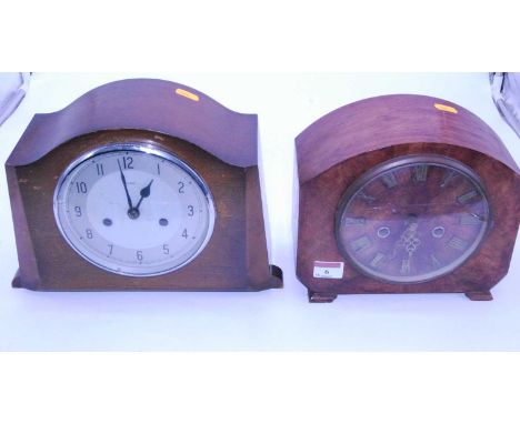 A 1950s walnut cased mantel clock having raised Roman numerals with eight day movement, width 23cm, together with one other 1