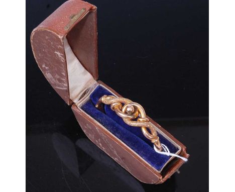 A late Victorian 9ct gold hollow hinged bangle, with Celtic knot type decoration and further bright cut engraving, 13.3g, 7cm