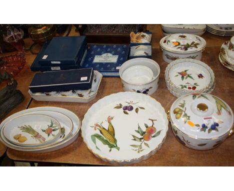 A collection of Royal Worcester oven-to-table wares in the Evesham pattern; together with various boxed Royal Worcester place