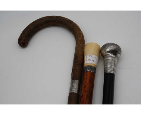 A late Victorian walking cane, having a mallacca shaft with silver collar and ivory handle, length 91cm; together with a late