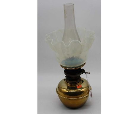 A late Victorian brass oil lamp with chimney, having frilled vaseline glass shade, (h.34cm excluding chimney)