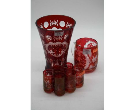 A 20th century Bohemian style ruby glass vase of conical form, etched with deer and birds, height 20cm, together with a simil