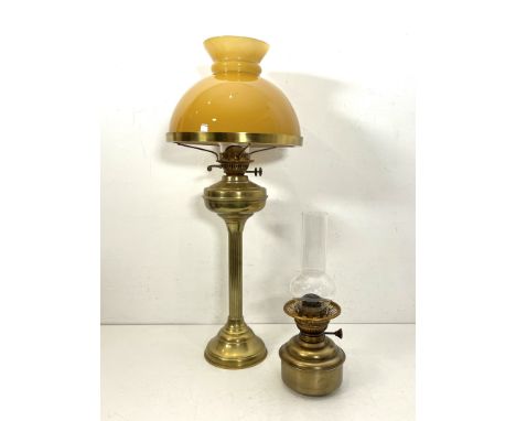 A Victorian style brass and amber cased glass column oil lamp - 69.8cm high excluding chimney; together with a small brass Id