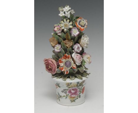 A Bow flowerpot, painted with flowers and foliage, encrusted with issuing flowers, 22cm high, c.1760