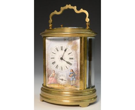 A late 19th/early 20th century gilt metal and enamelled oval repeater carriage clock, enamelled with courting couple, he with