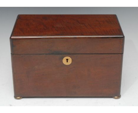 A Victorian mahogany rounded rectangular tea caddy, quite plain, the hinged cover enclosing a covered mixing bowl and a lidde
