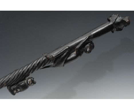 A late 19th century Folk Art ebonised walking cane, the pommel with snuff box, in the form of a frog, the haft with monkey an