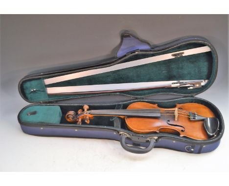 A 19th century German violin, Guarnerious copy, the two-piece back 35cm long excluding button,  outlined throughout with purf
