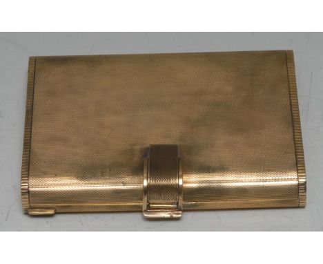 A Continental silver-gilt rounded rectangular vanity case, engine turned overall, hinged cover enclosing a mirror and an arra