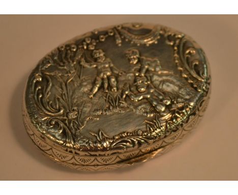 A Dutch silver oval snuff box, embossed with putti frolicking and gathering fruit, 5.5cm wide, c.1900