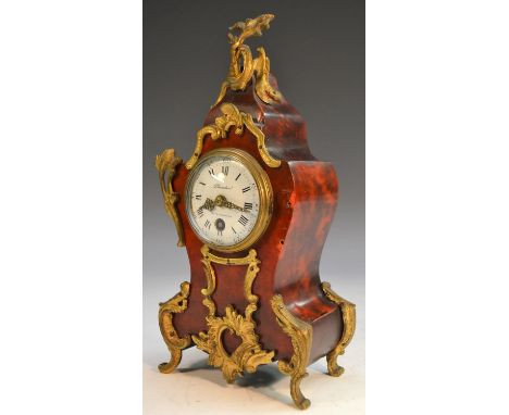 A French tortoiseshell and gilt metal cartouche shaped mantel clock, the white enamelled dial with Roman numerals, inscribed 