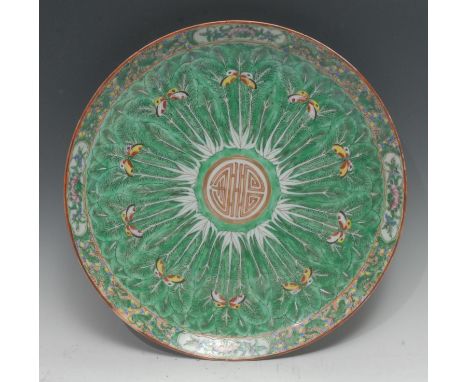 A large Chinese famille verte porcelain circular charger, centred by the Shou character of longevity in gilt and iron red, th