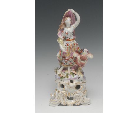 A Bow figure, of Juno as Air, she stands bare footed holding a robe above her head beside a large eagle, high flower encruste