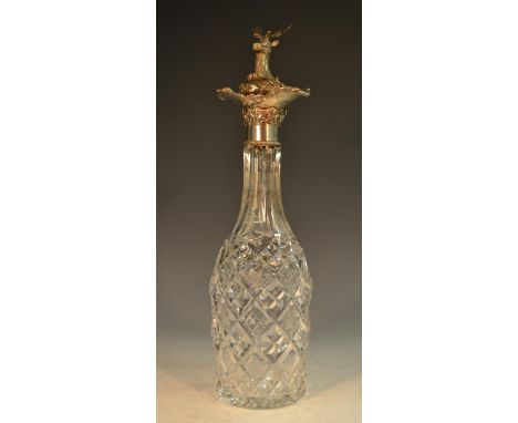 An early Victorian Rococo Revival silver-mounted crystal decanter, the mallet-shaped reservoir hobnail cut and etched with vi