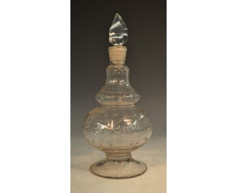 An unusual early 19th century minaret decanter, cut and faceted reservoir, neck and shoulder, leaf-shaped stopper, domed circ