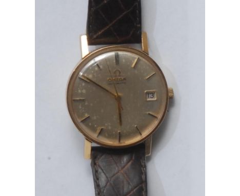 Omega - a vintage 1960s gentleman's 9ct gold cased wristwatch, brushed textured champagne dial, block baton indicators, centr
