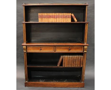 A Regency parcel-gilt rosewood open library bookcase, the waterfall superstructure with pierced three-quarter gallery, the pr