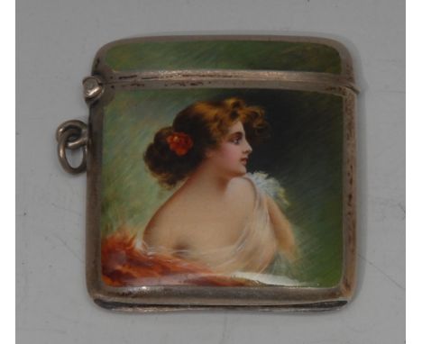 An early 20th century silver and enamel bowed rounded rectangular vesta case, painted with a bust-length profile of a scantil