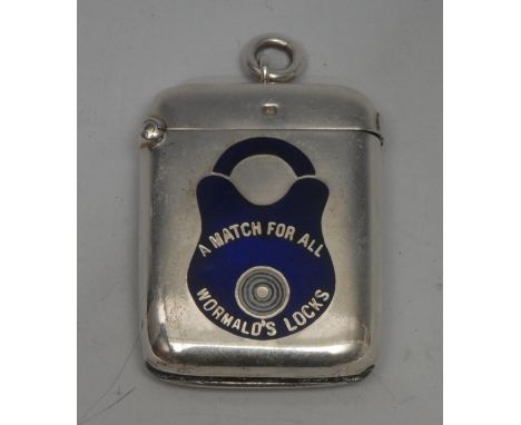 Advertising - an Edwardian silver and enamel rounded rectangular vesta case, A Match for All/Wormald's Locks, decorated in bl