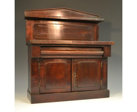 A Victorian mahogany miniature chiffonier, pointed arched back with open shelf, cushion moulded frieze drawer above a pair of