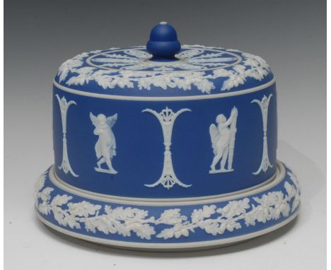 A Wedgwood type blue jasper stilton dome, typically sprigged in white with classical figures, fruiting oak borders, acorn fin