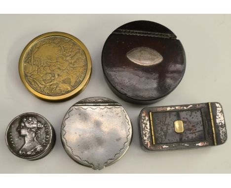 A late George III silver-mounted papier-mâché circular snuff box, the cover with an onset navette-shaped wrigglework cartouch