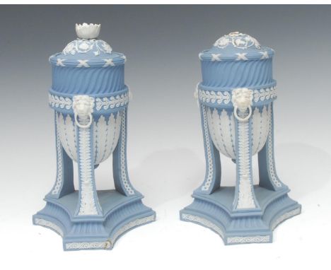 A pair of Wedgwood blue jasper cassolettes, the ovoid bowls applied white relief with stiff leaves, tripod legs with acanthus