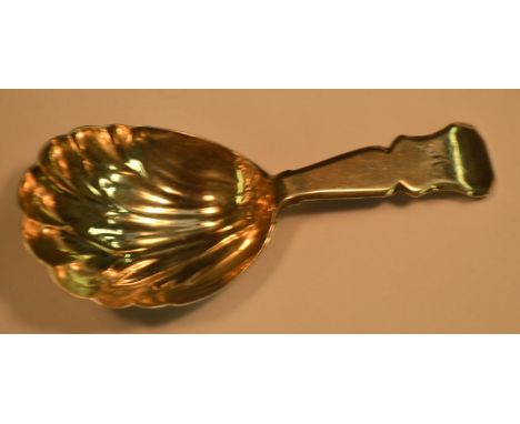 A George III silver caddy spoon, shell shaped bowl, shaped stem, 9cm long, Thomas Robinson II &amp; S Harding, London 1790